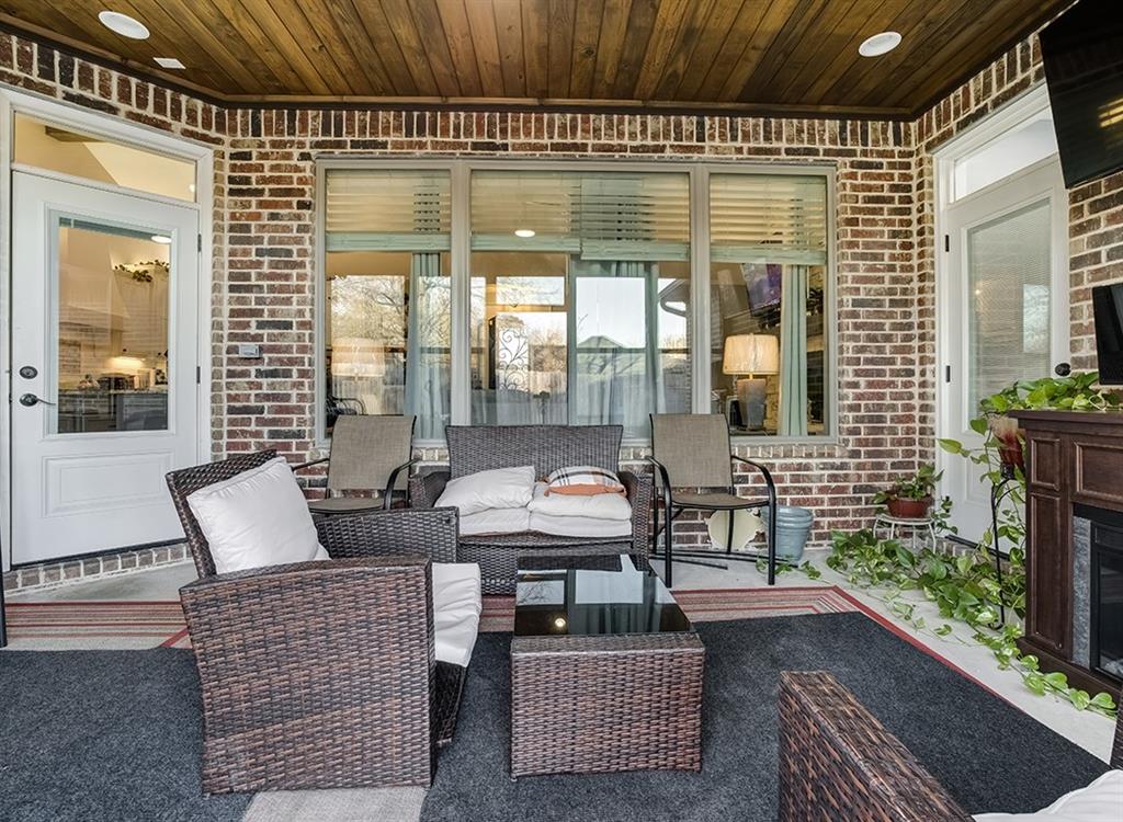 523 Mitchell Ryan Wake Village, TX 75501 - Photo 10 of 37 a outdoor space with patio the couches and a dining table with garden view