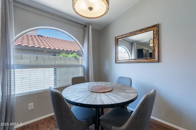 a view of a dining room with furniture and window
