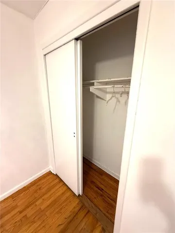 a view of front door with wooden floor