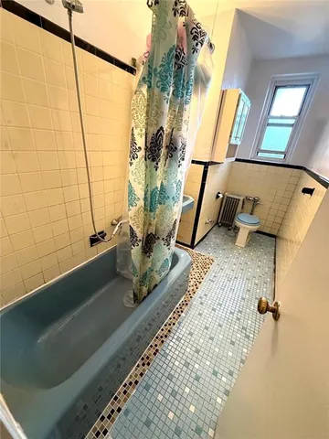 a bathroom with a tub and a sink