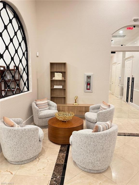 Undisclosed Address Naples, FL 34119 - Photo 12 of 20 a living room with furniture and a potted plant