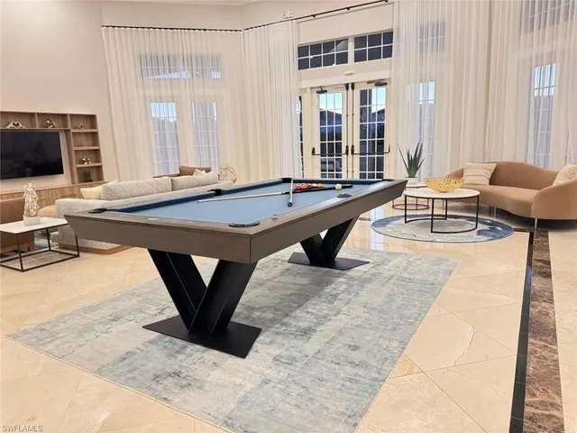 a living room with a couch and a flat screen tv