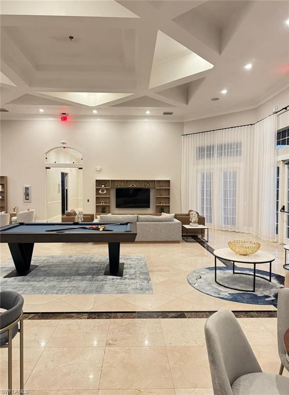 Undisclosed Address Naples, FL 34119 - Photo 14 of 20 a living room with furniture and a flat screen tv