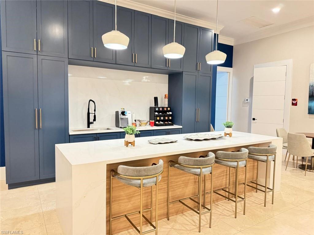 Undisclosed Address Naples, FL 34119 - Photo 15 of 20 a kitchen with a table and chairs in it