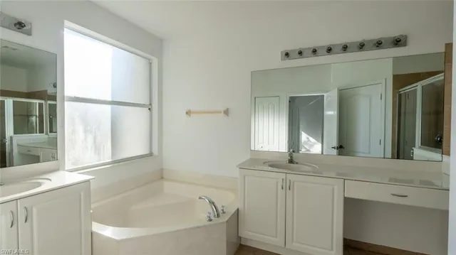 a bathroom with a bathtub and a sink