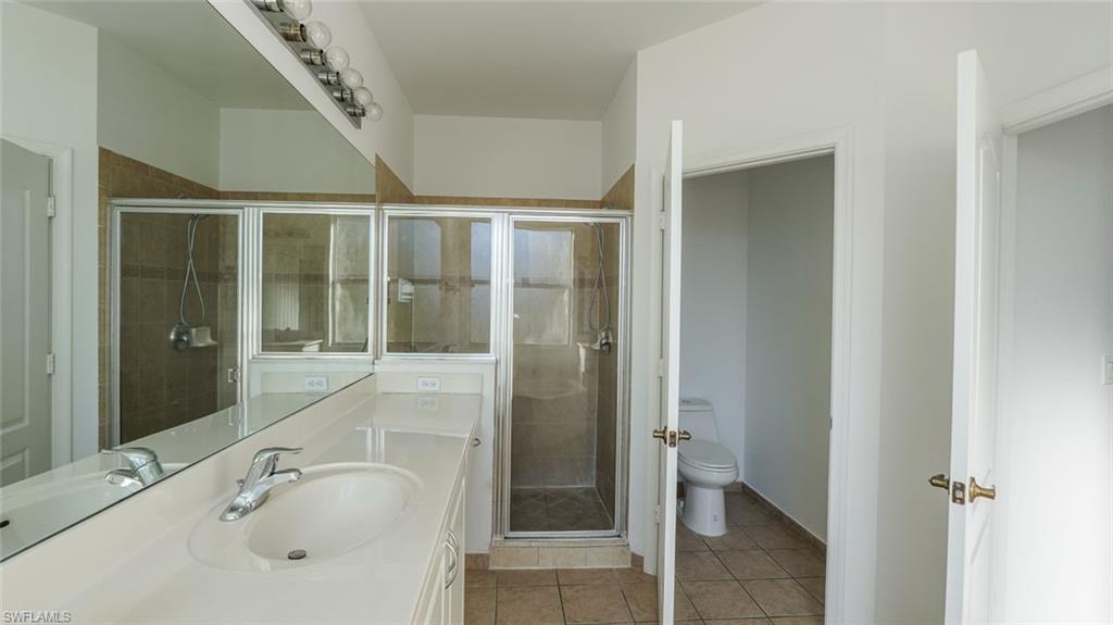 Undisclosed Address Naples, FL 34119 - Photo 6 of 20 a bathroom with a tub and shower