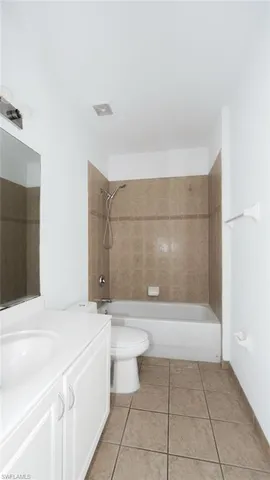 a bathroom with a bathtub and toilet