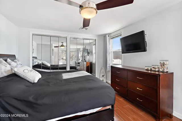 a bedroom with a bed and a dresser