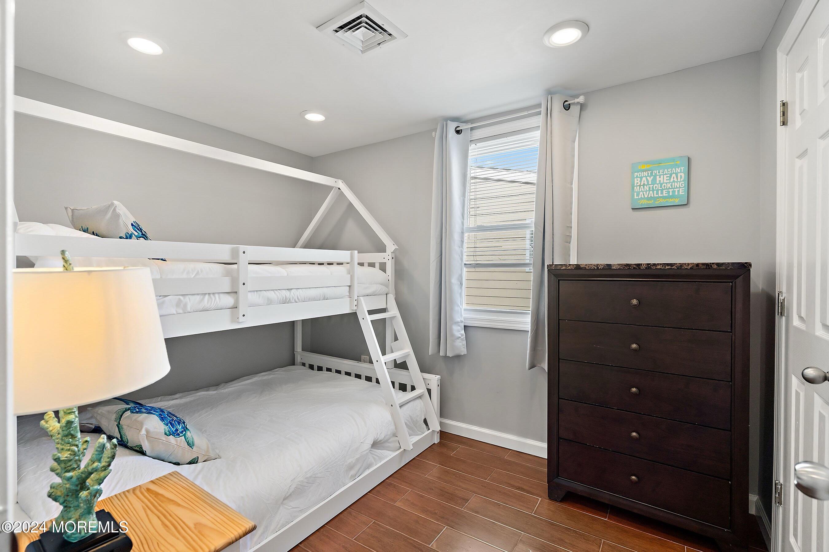 212 Randall Avenue Point Pleasant Beach, NJ 08742 - Photo 5 of 18 a bedroom with a bed and a dresser