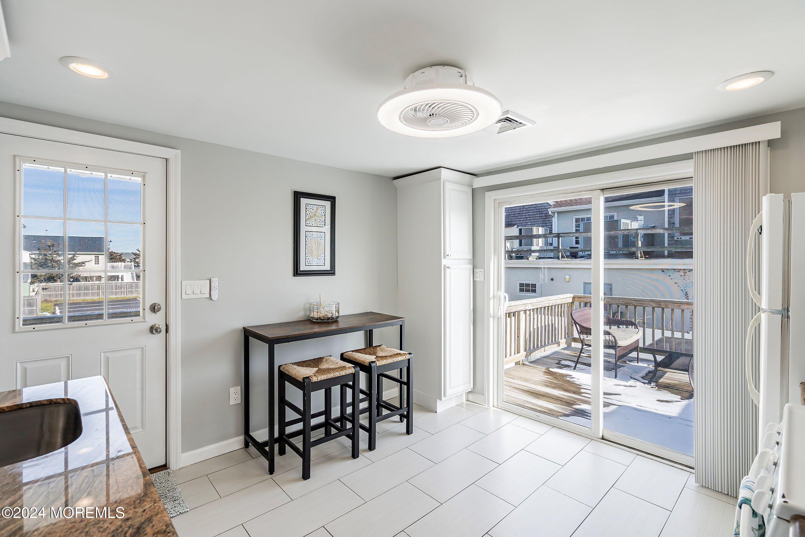212 Randall Avenue Point Pleasant Beach, NJ 08742 - Photo 9 of 18 a view of a dining room with furniture and front door
