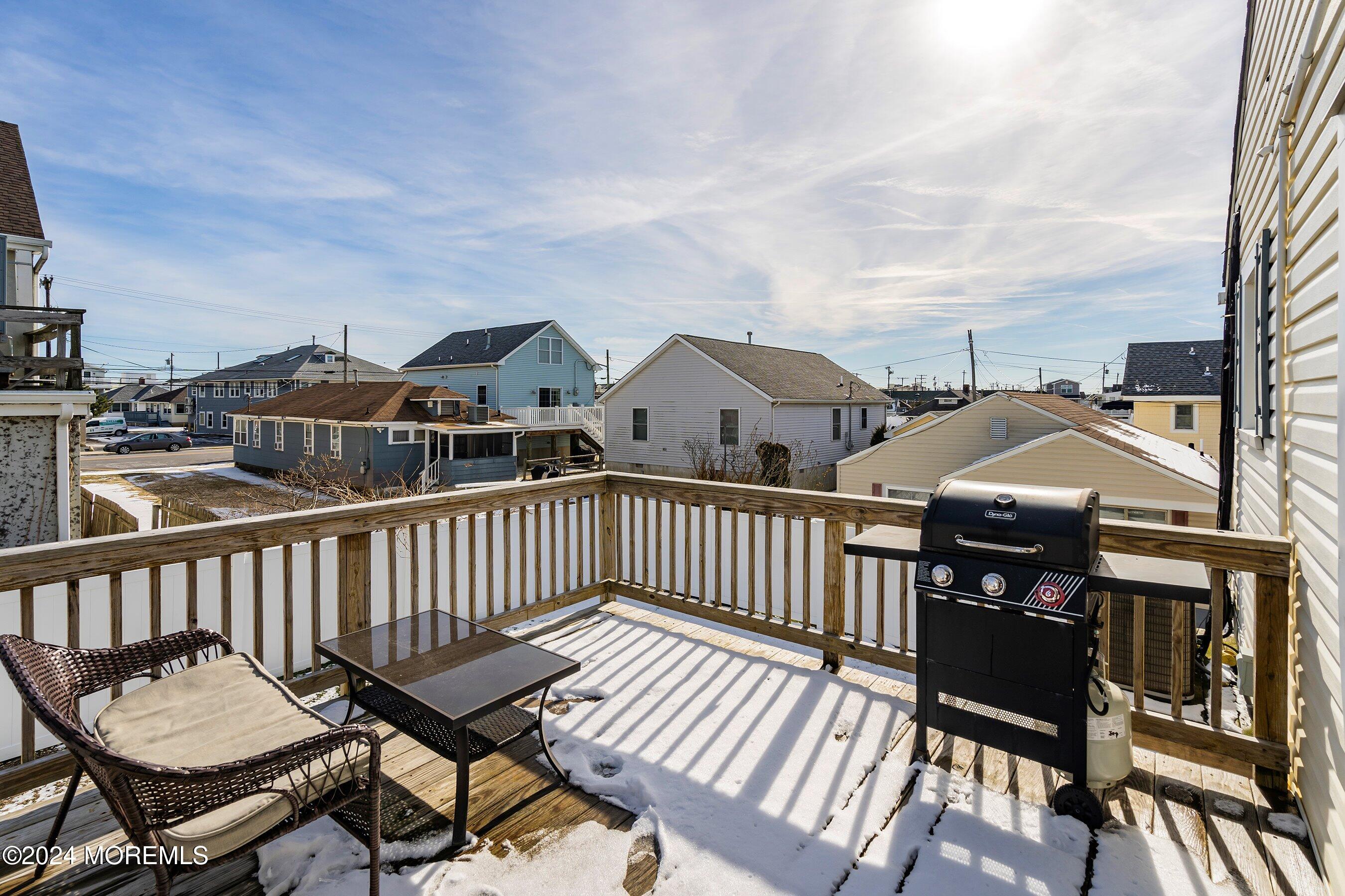 212 Randall Avenue Point Pleasant Beach, NJ 08742 - Photo 10 of 18 a view of a chairs and table on the deck
