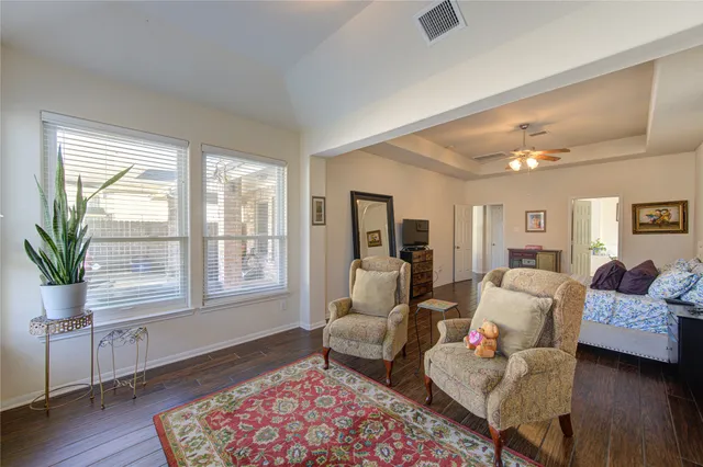 a bathroom with a bathtub sink and mirror