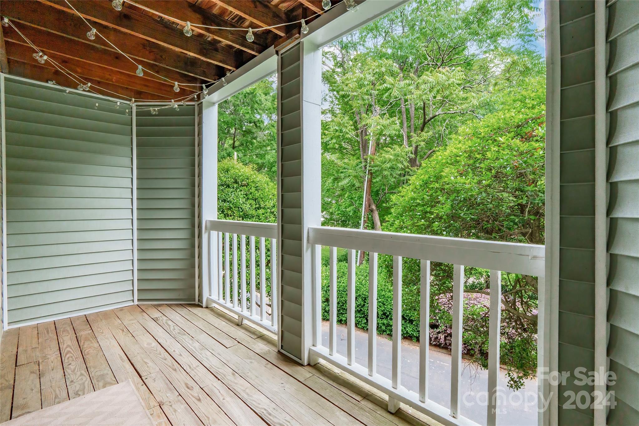 430 Queens Road, Unit 322 Charlotte, NC 28207 - Photo 2 of 20 a view of a balcony with wooden floor