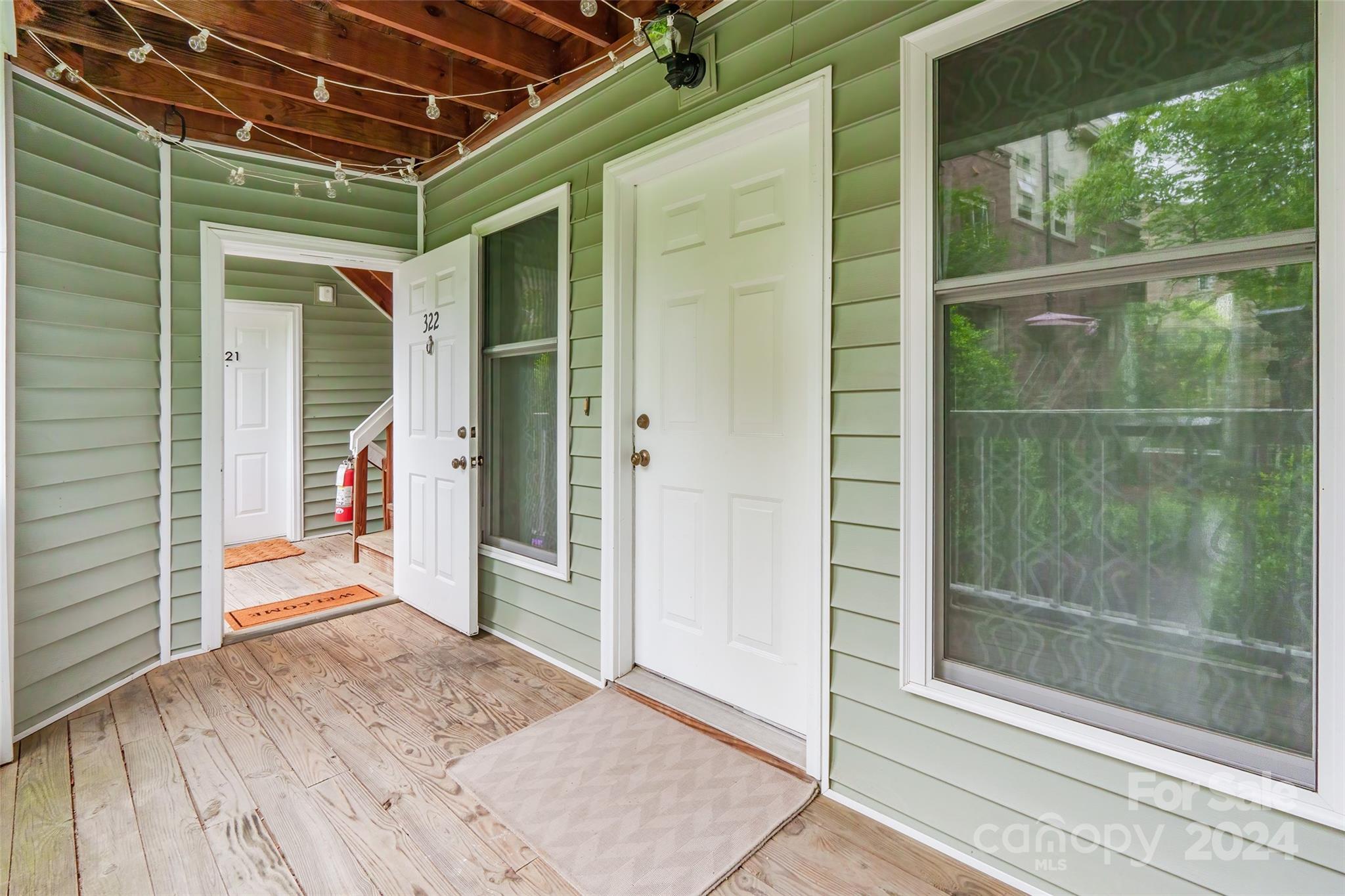 430 Queens Road, Unit 322 Charlotte, NC 28207 - Photo 3 of 20 a view of a glass door of the house