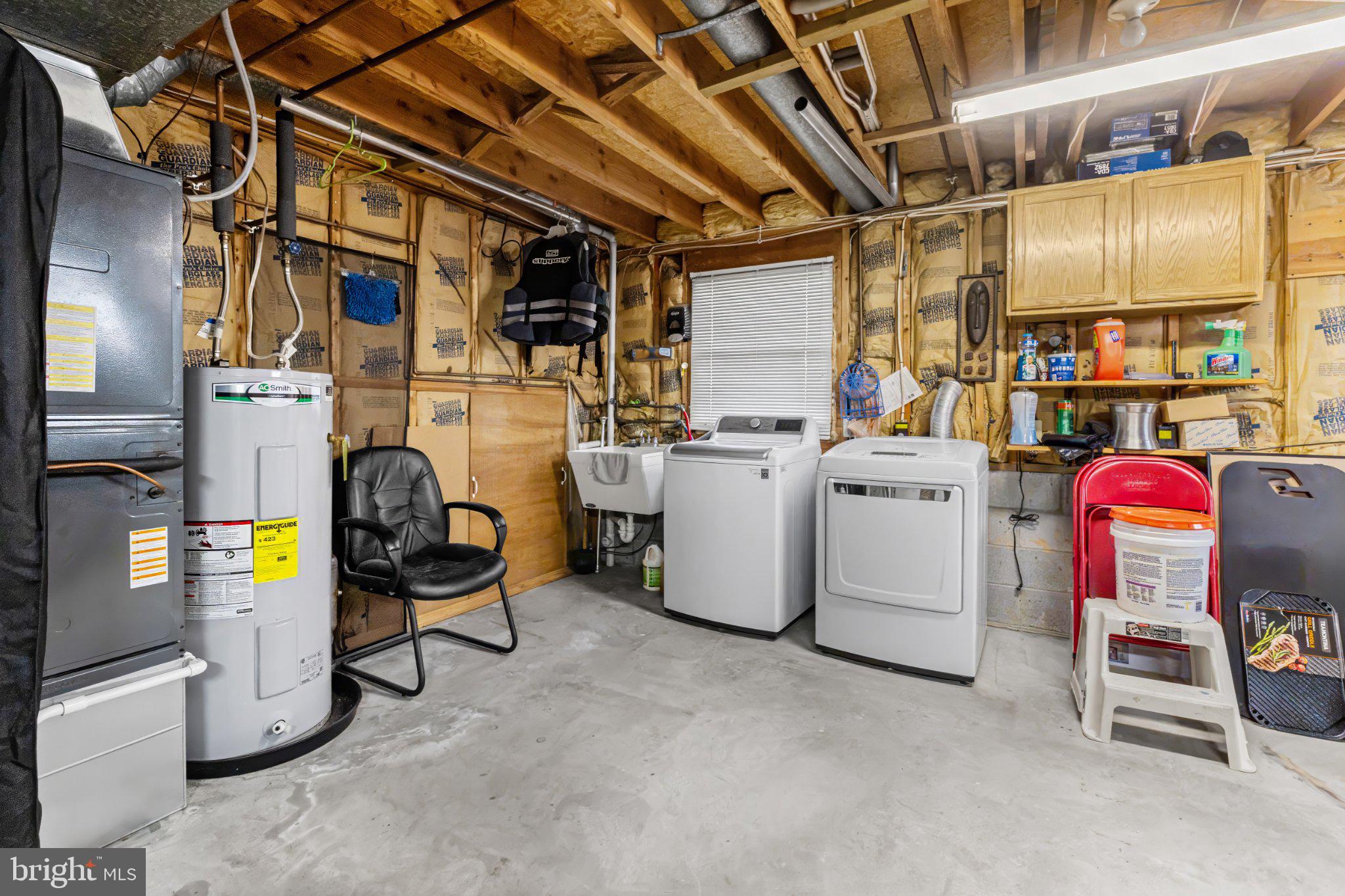 1317 Roxboro Road Baltimore, MD 21237 - Photo 26 of 30 Functional laundry space with storage.