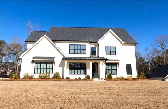 a front view of a house with a yard