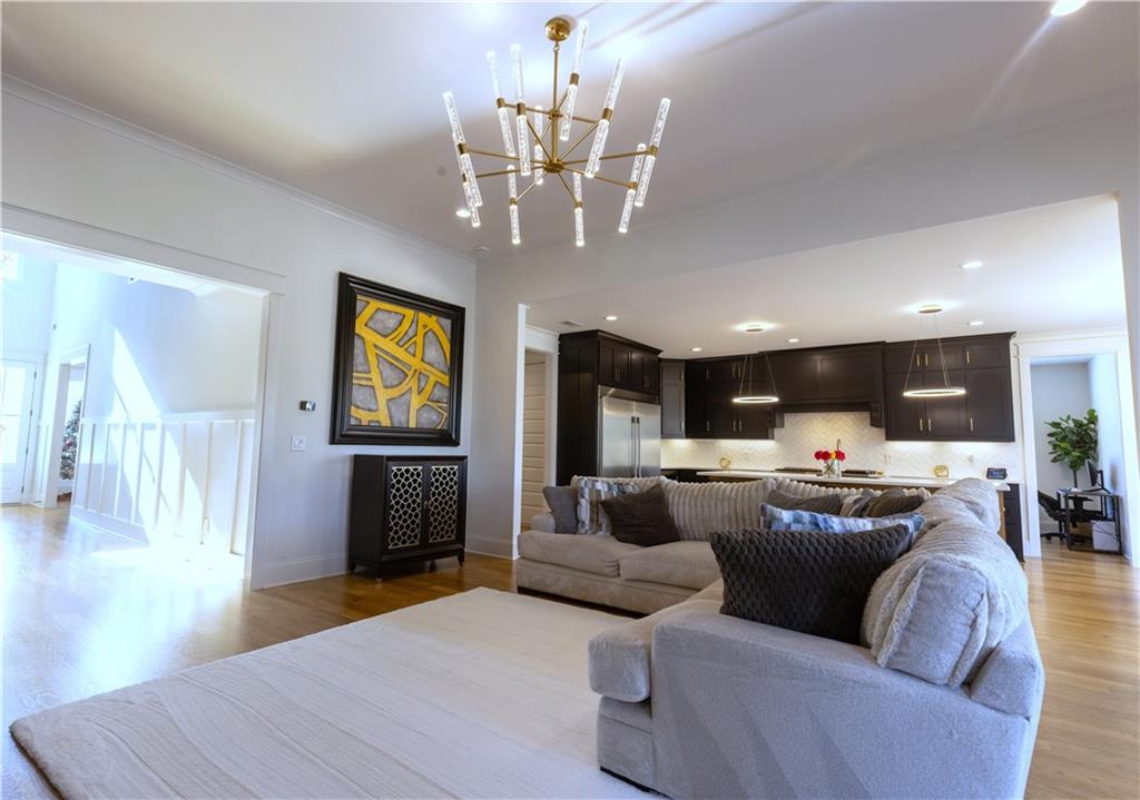 155 Dean Drive Tyrone, GA 30290 - Photo 14 of 50 a living room with fireplace furniture and a chandelier