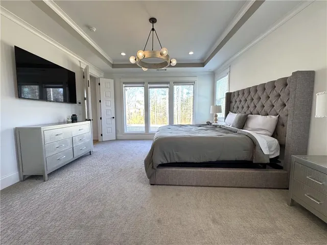 a spacious bathroom with a double vanity sink tub and mirror