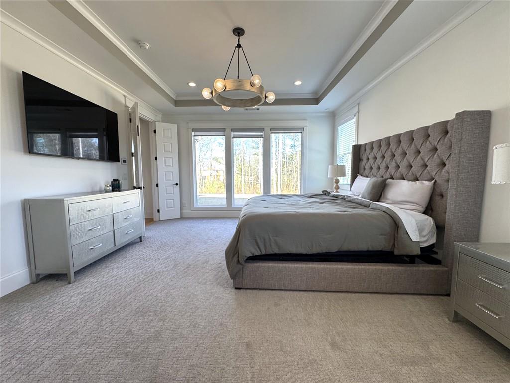 155 Dean Drive Tyrone, GA 30290 - Photo 18 of 50 a spacious bedroom with a bed and a flat screen tv