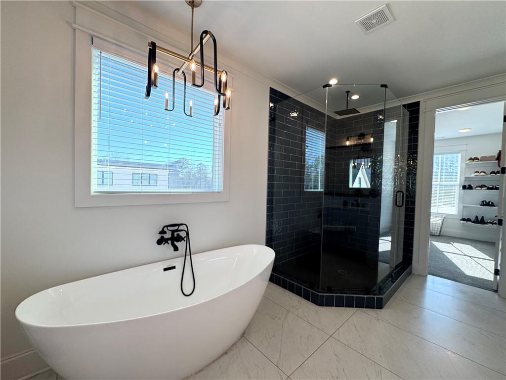 155 Dean Drive Tyrone, GA 30290 - Photo 20 of 50 a bathroom with a tub and shower