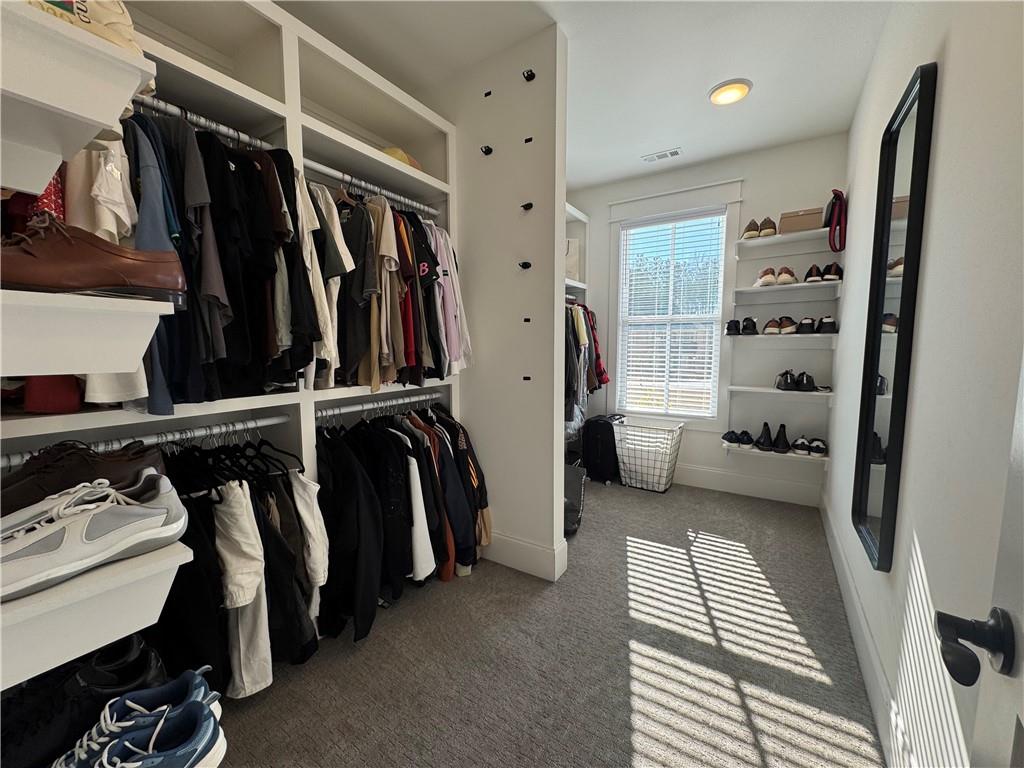 155 Dean Drive Tyrone, GA 30290 - Photo 21 of 50 a view of walk in closet with clothes and shoes