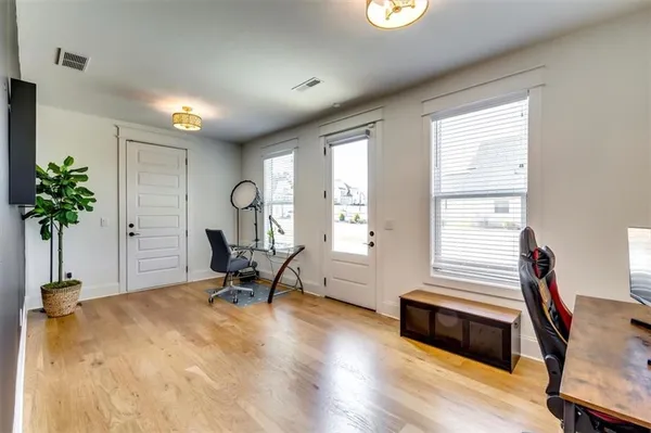 a bed room with a bed and a chair