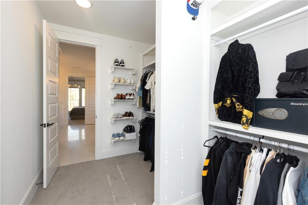 155 Dean Drive Tyrone, GA 30290 - Photo 22 of 50 a view of walk in closet with clothes and shoes