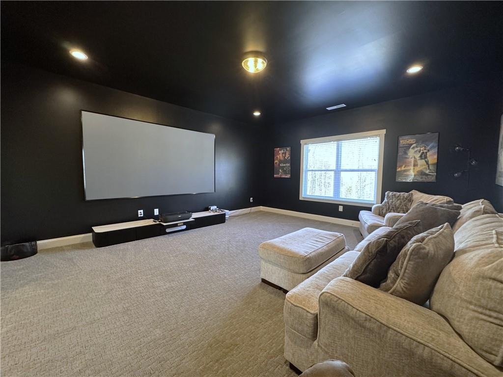 155 Dean Drive Tyrone, GA 30290 - Photo 26 of 50 a living room with couches and projector with a large screen