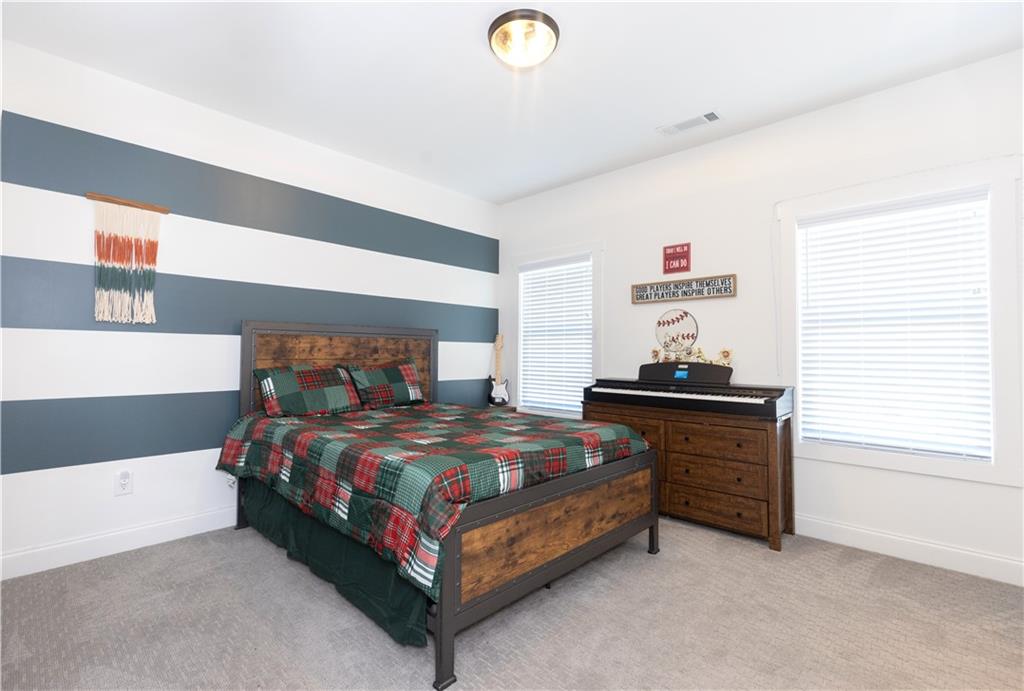 155 Dean Drive Tyrone, GA 30290 - Photo 28 of 50 a bedroom with a bed and a window