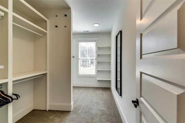 a bathroom with a tub shower and toilet