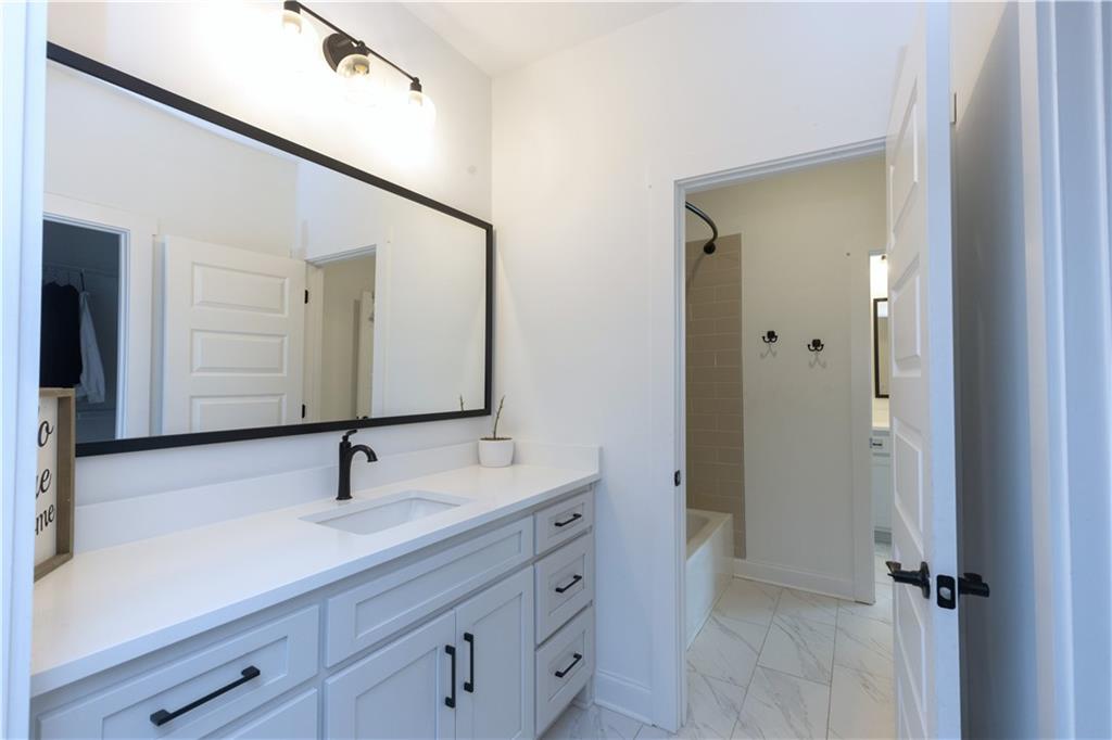 155 Dean Drive Tyrone, GA 30290 - Photo 30 of 50 a bathroom with a sink and mirror