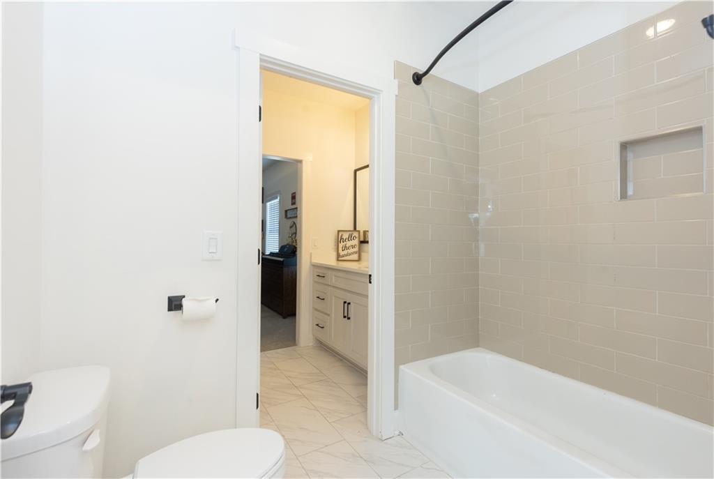 155 Dean Drive Tyrone, GA 30290 - Photo 31 of 50 a bathroom with a granite countertop toilet and a shower