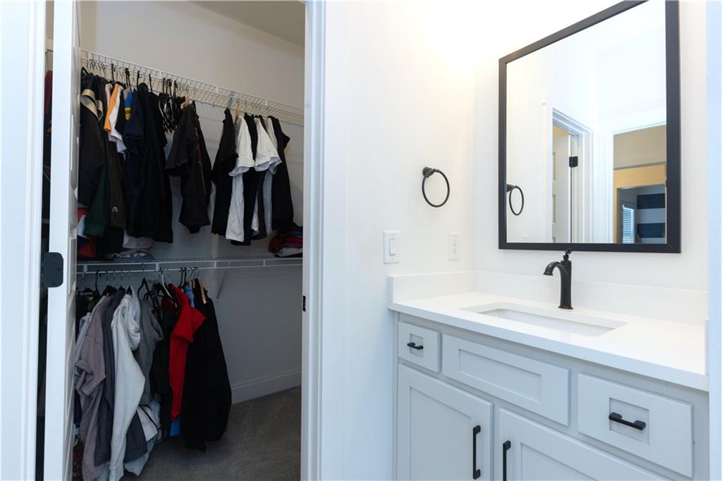 155 Dean Drive Tyrone, GA 30290 - Photo 32 of 50 a view of walk in closet with clothes and shoes