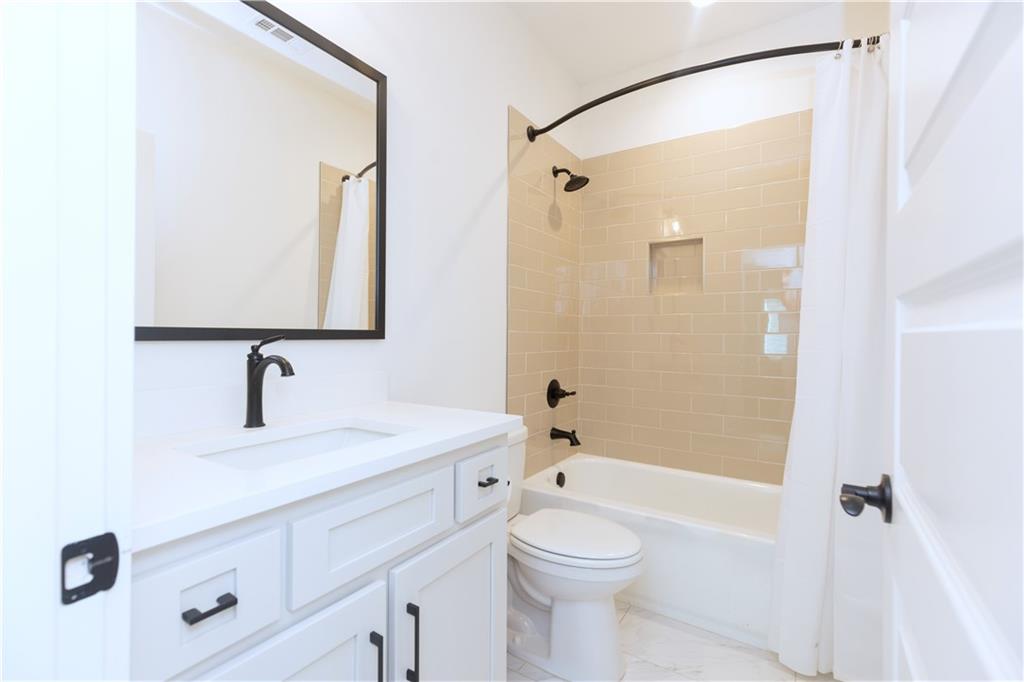 155 Dean Drive Tyrone, GA 30290 - Photo 36 of 50 a bathroom with a sink a toilet and shower