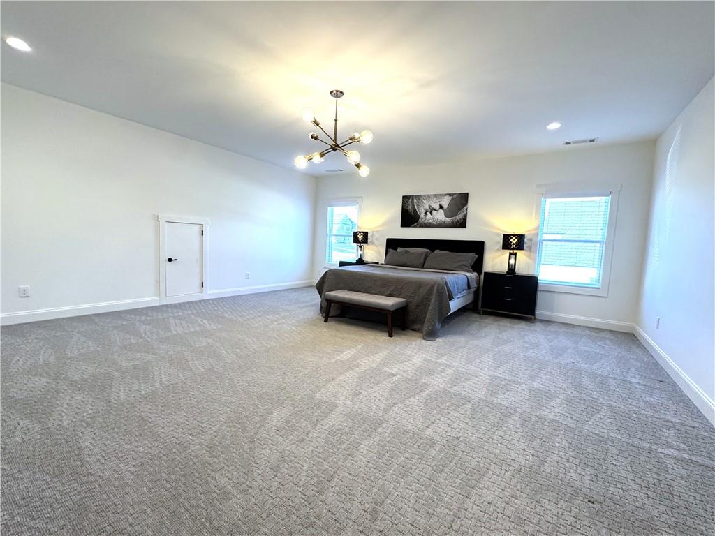 155 Dean Drive Tyrone, GA 30290 - Photo 38 of 50 a living room with furniture and a chandelier