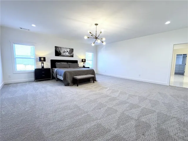 a spacious bathroom with a bathtub and a sink