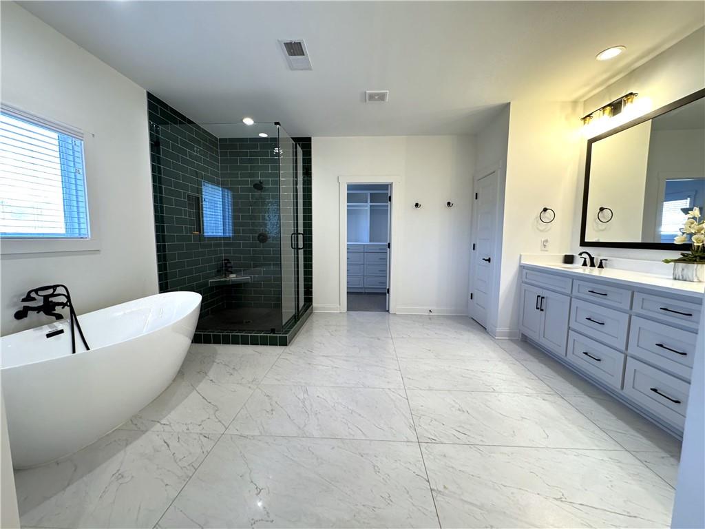 155 Dean Drive Tyrone, GA 30290 - Photo 40 of 50 a spacious bathroom with a bathtub sink and mirror