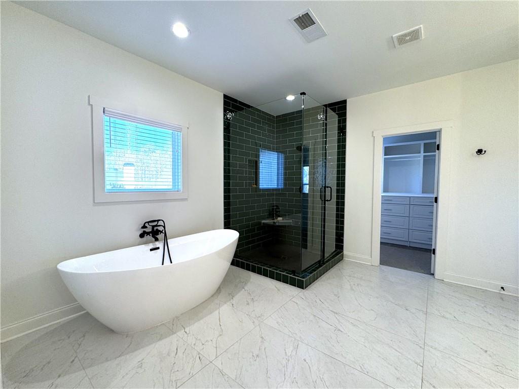 155 Dean Drive Tyrone, GA 30290 - Photo 41 of 50 a spacious bathroom with a bathtub and a sink