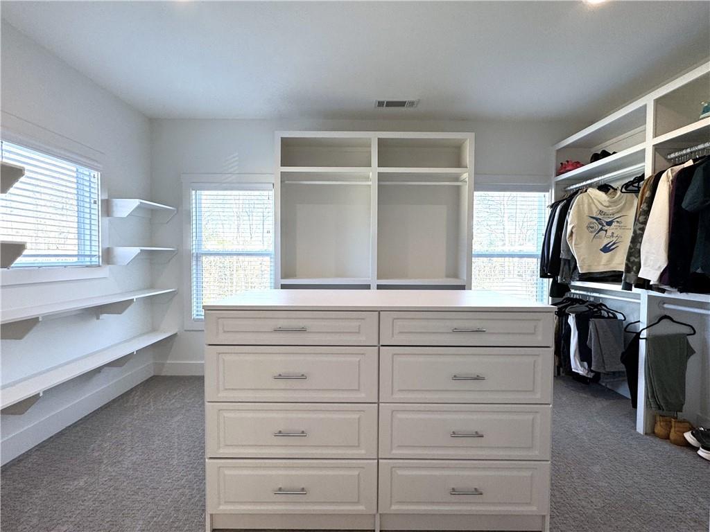 155 Dean Drive Tyrone, GA 30290 - Photo 43 of 50 a view of walk in closet with clothes and shoes