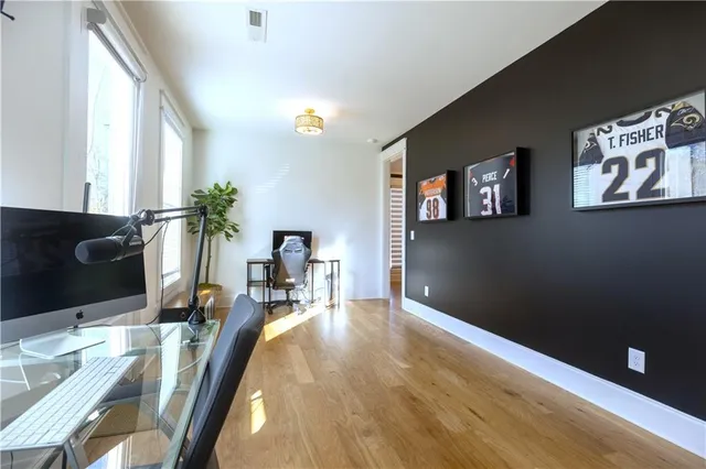 a living room with furniture fireplace and flat screen tv
