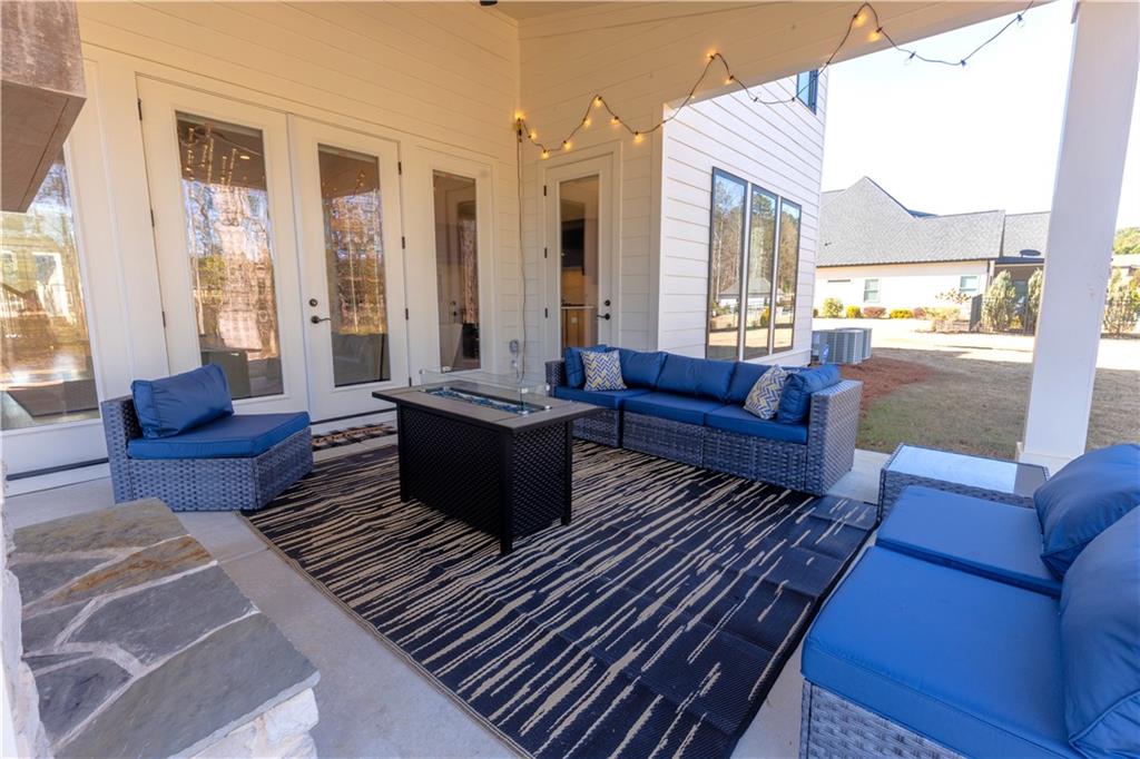 155 Dean Drive Tyrone, GA 30290 - Photo 46 of 50 a living room with furniture or couch and a large window