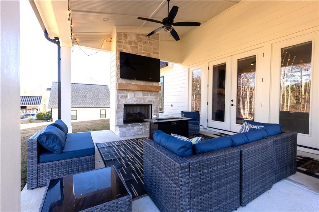 155 Dean Drive Tyrone, GA 30290 - Photo 47 of 50 a living room with furniture fireplace and flat screen tv