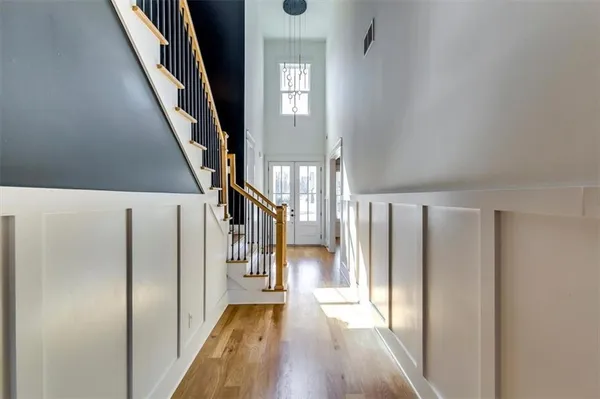 a view of entryway with stairs and wooden floor