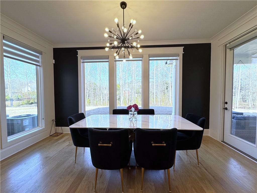 155 Dean Drive Tyrone, GA 30290 - Photo 9 of 50 a view of a dining room with furniture window and wooden floor