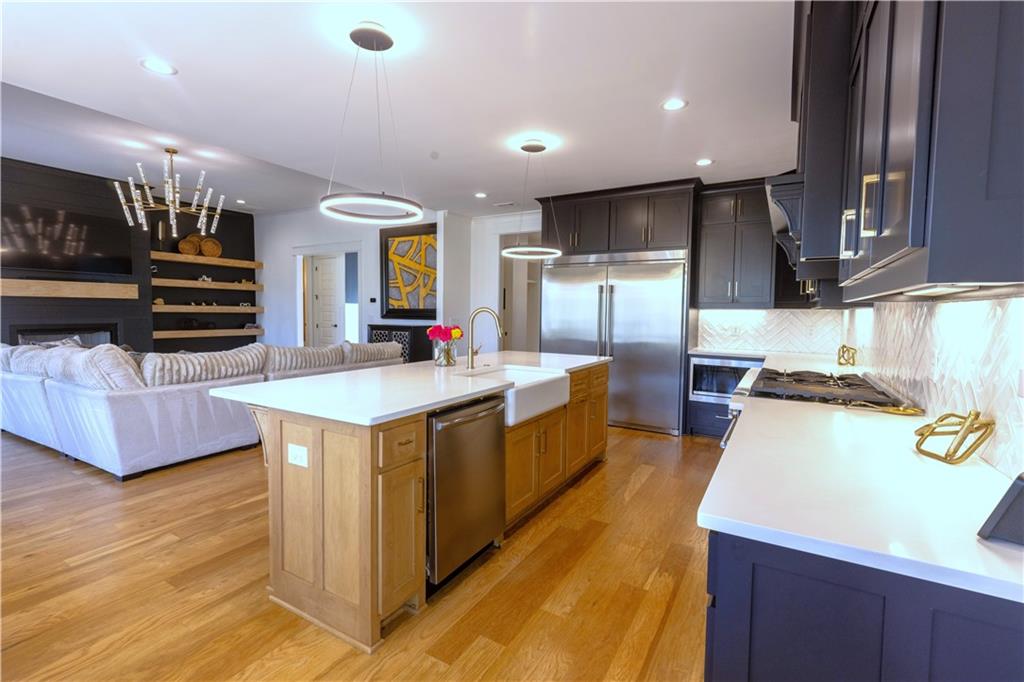 155 Dean Drive Tyrone, GA 30290 - Photo 10 of 50 a large kitchen with stainless steel appliances a sink a stove and a refrigerator