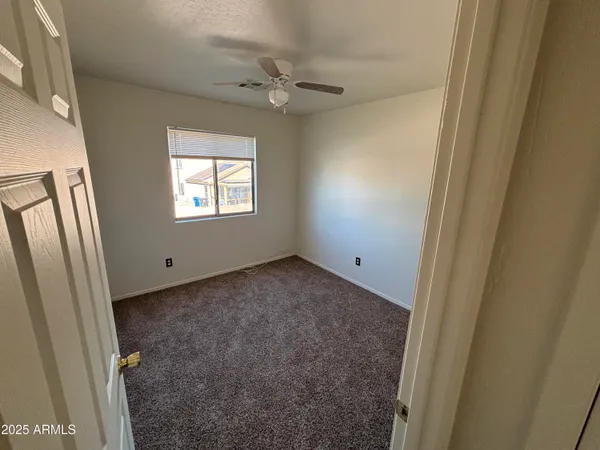 a view of a window in an empty room