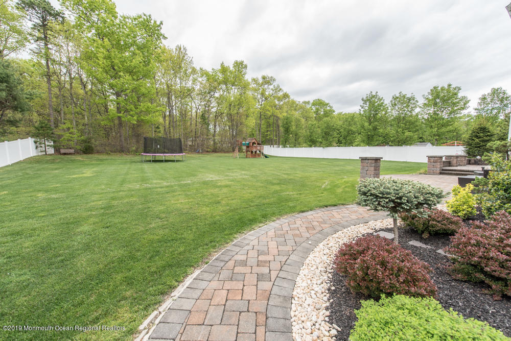 11 Round Hill Road Jackson, NJ 08527 - Photo 14 of 69 a view of a garden with a fountain