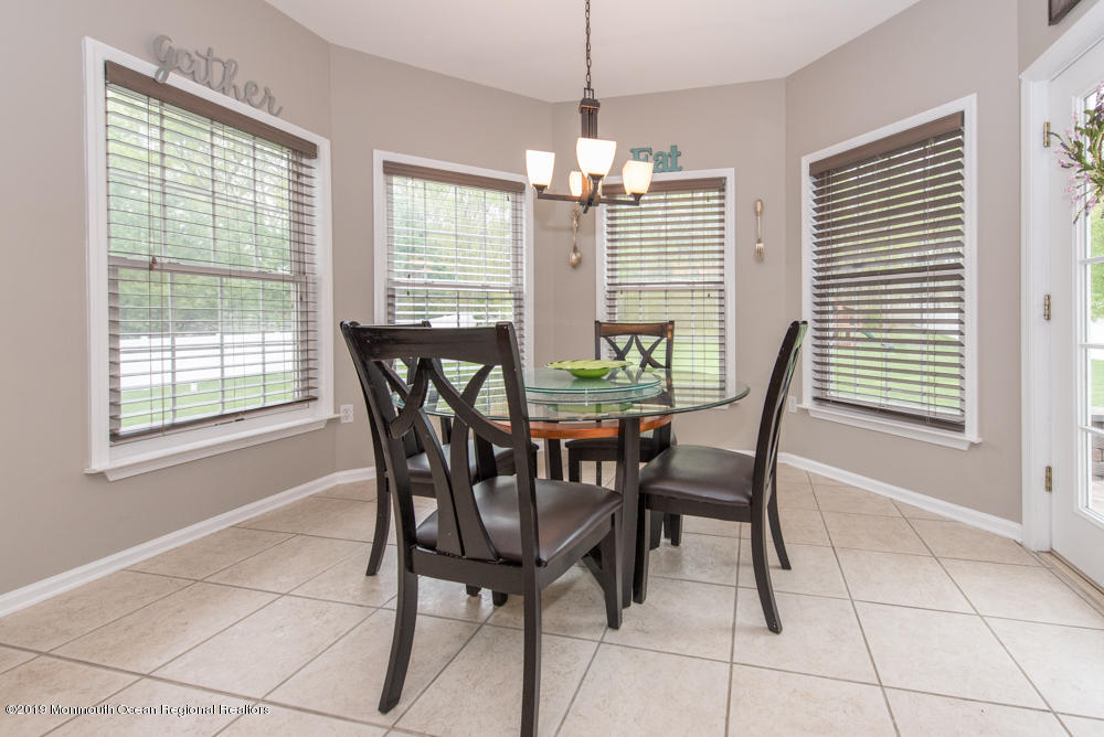 11 Round Hill Road Jackson, NJ 08527 - Photo 19 of 69 a view of a dining room with furniture and windows