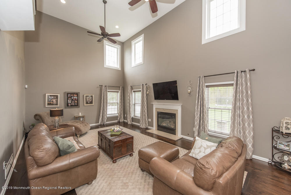11 Round Hill Road Jackson, NJ 08527 - Photo 21 of 69 a living room with furniture a window and a fireplace