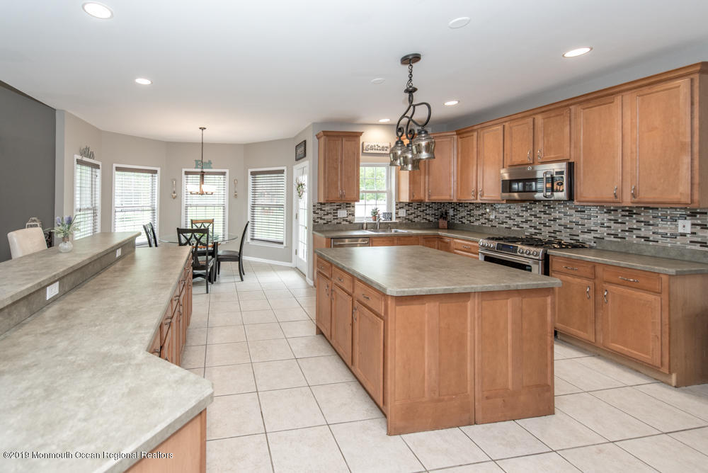 11 Round Hill Road Jackson, NJ 08527 - Photo 24 of 69 a kitchen with stainless steel appliances granite countertop a sink counter space cabinets and a counter top space